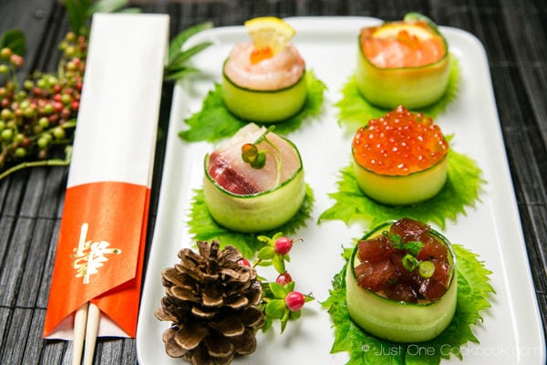 Cucumber Wrapped Sushi on a white plate.