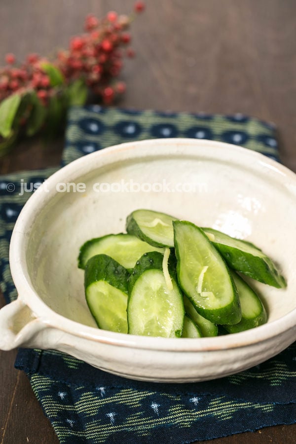 Pickled Cucumbers in a white bowl.