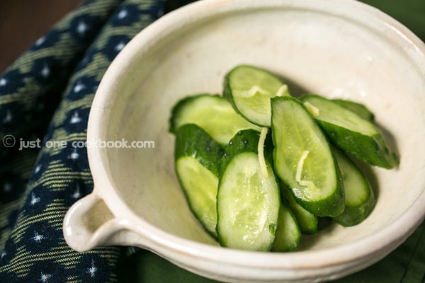 Pickled Cucumbers in a white bowl.