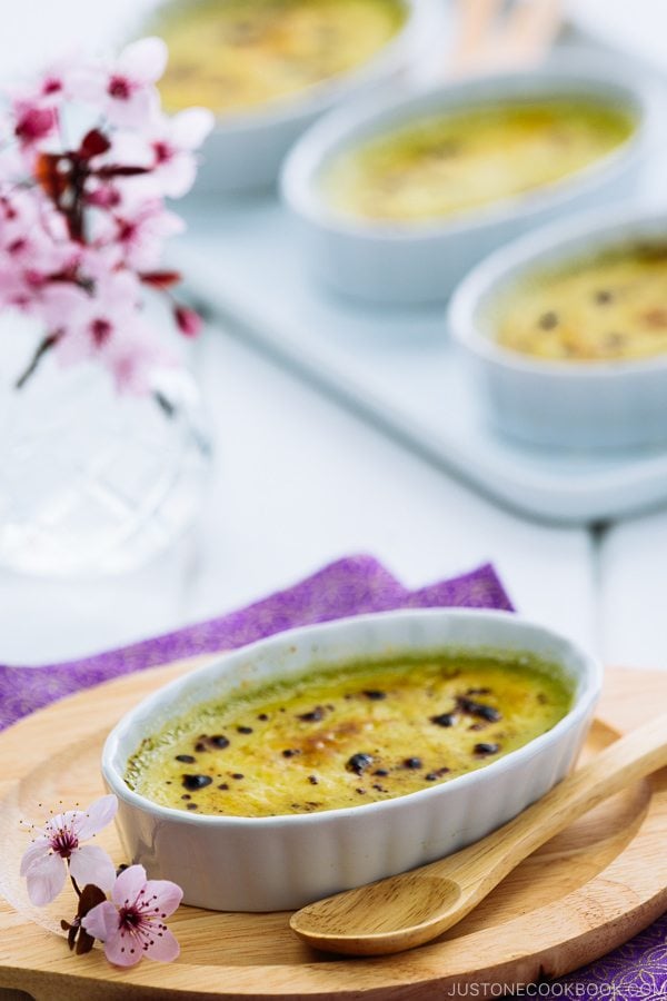 Green tea creme brulee in a white ramekin.