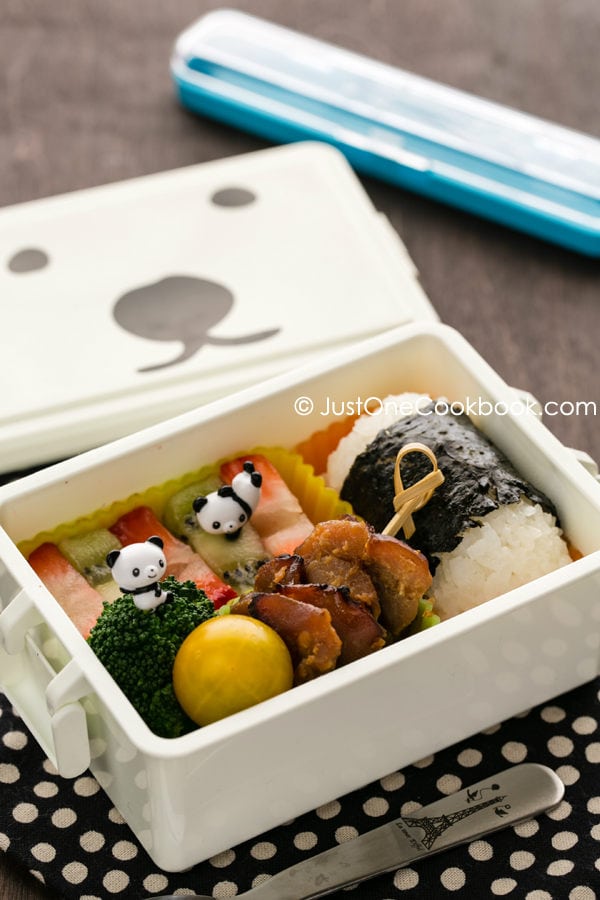 Garlic Miso Chicken Bento on a picnic table.