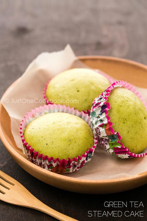 Green Tea Steamed Cake in cups on a plate.