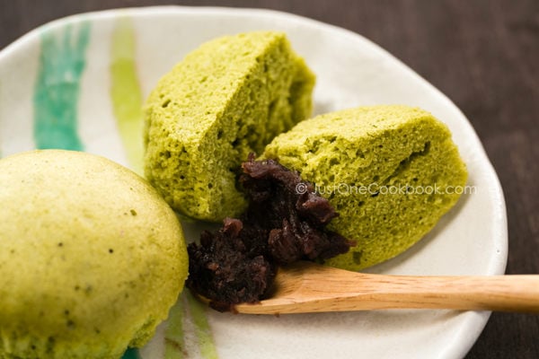 Green Tea Steamed Cake with red bean past on a plate.