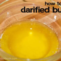 clarified butter inside a glass bowl on top of cutting board