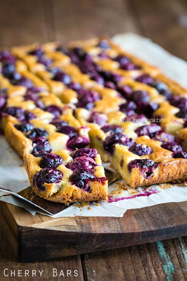 Cherry Bars on a wooden cutting board.