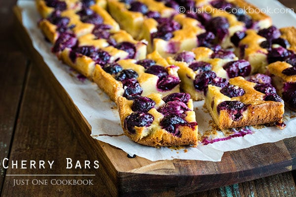 Cherry Bars on a wooden cutting board.