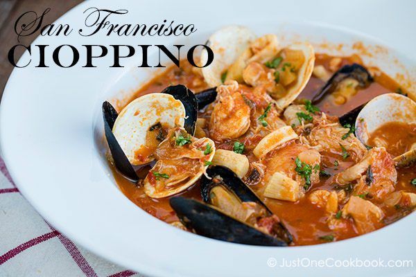 Cioppino in a white soup bowl.