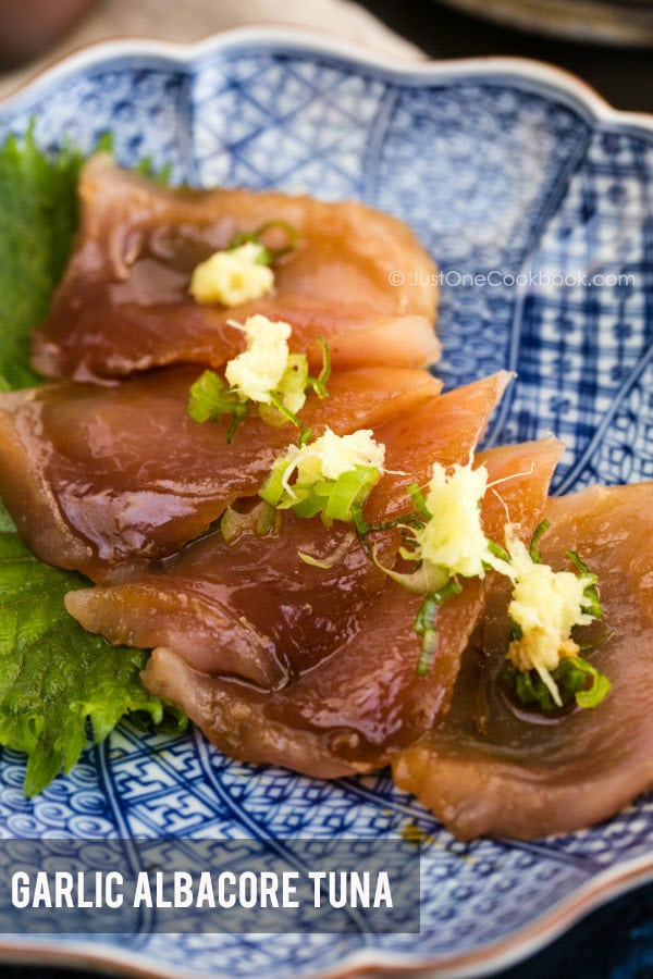 Garlic Albacore Tuna sashimi on a plate.