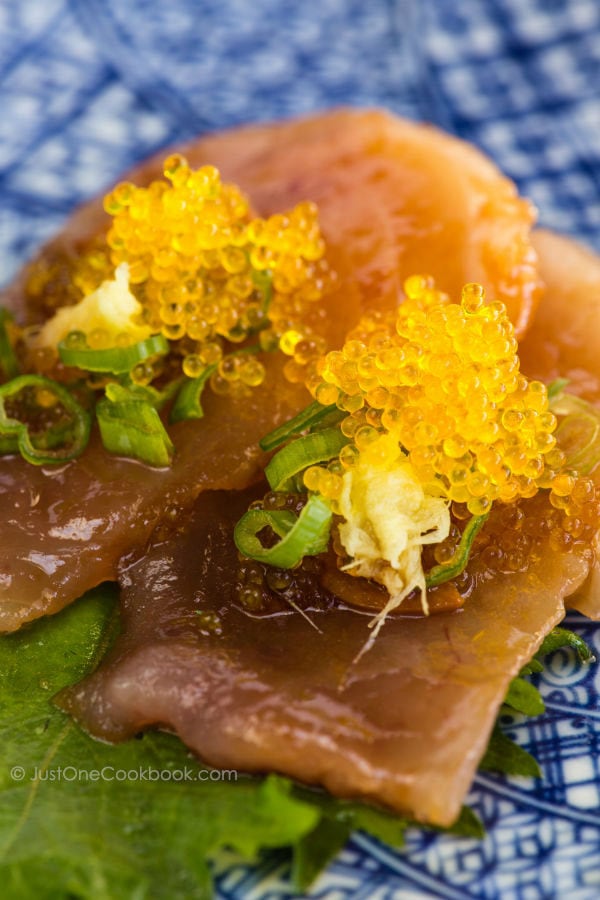 Garlic Albacore Tuna sashimi on a plate.