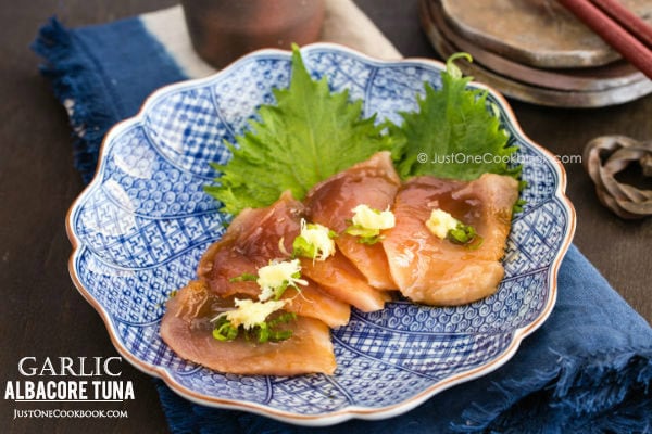 Garlic Albacore Tuna sashimi on a plate.