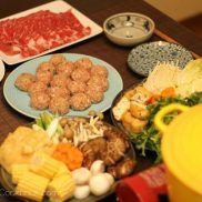 Taiwanese hot pot and homemade meatballs on a table.
