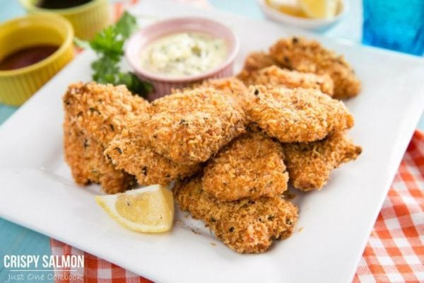 Crispy Salmon on a white plate with a sauce.