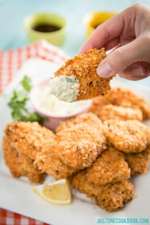 Tartar Sauce with crispy salmon on a white plate.