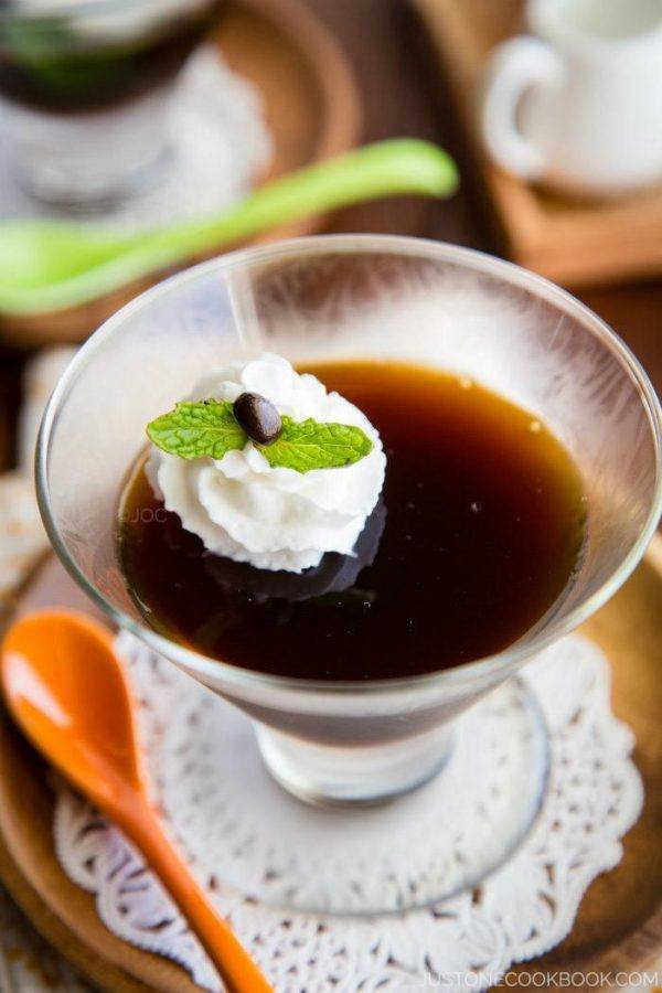 Coffee Jelly with whipped cream in a glass.
