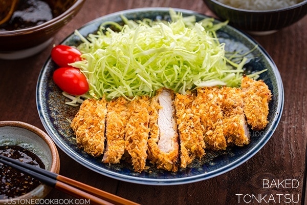 Baked Tonkatsu and salad on a plate.