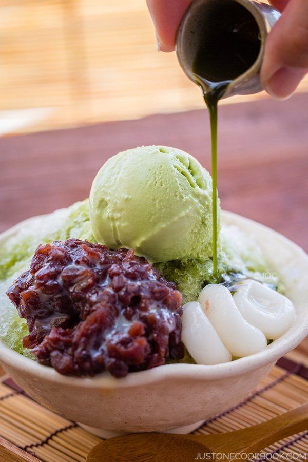 Green Tea Shaved Ice with matcha green tea ice cream, sweet red bean and shiratama dango in a bowl.