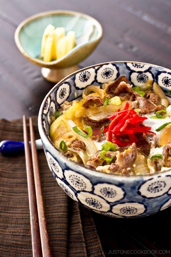 Gyudon in a bowl with red pickled ginger.