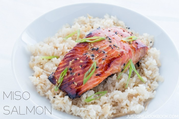 Miso Salmon over rice in a white bowl.