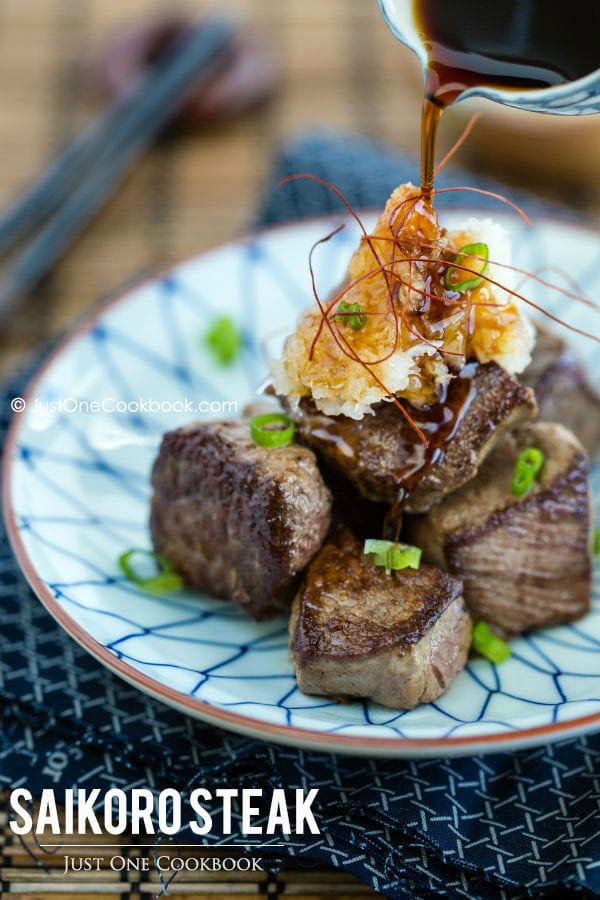 Saikoro Steak with grated daikon on a plate.