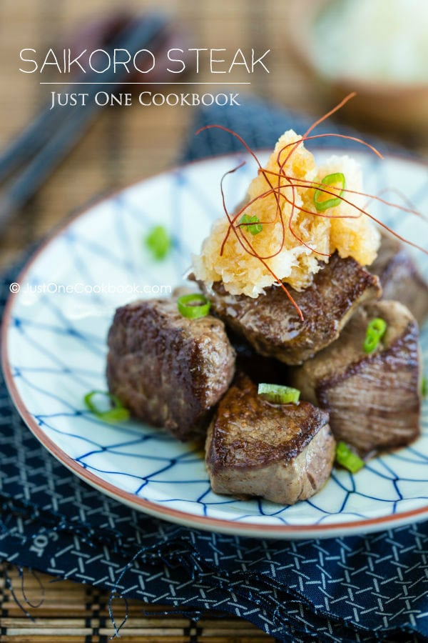 Saikoro Steak and grated daikon on a plate.