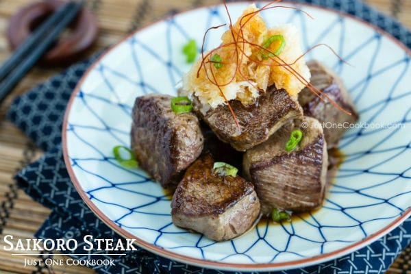 Saikoro Steak and grated daikon on a plate.