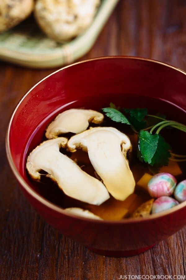 Matsutake Clear Soup in Japanese soup bowl on wooden table.