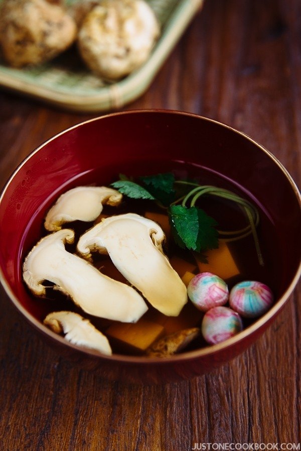 Matsutake Clear Soup in Japanese soup bowl on the wooden table.