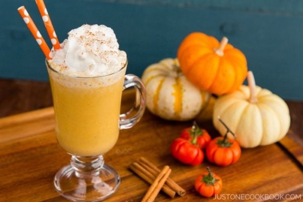 A glass of Pumpkin Smoothie with whipped cream on top.
