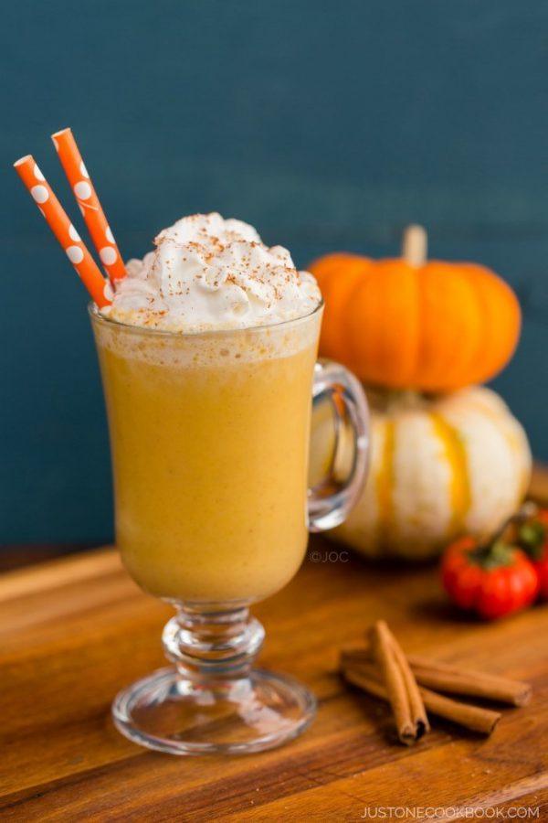 A glass of Pumpkin Smoothie with whipped cream on top.