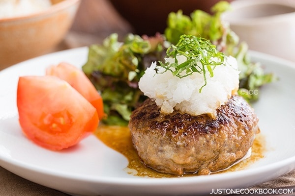 Japanese Hamburger Steak with salad on a plate.