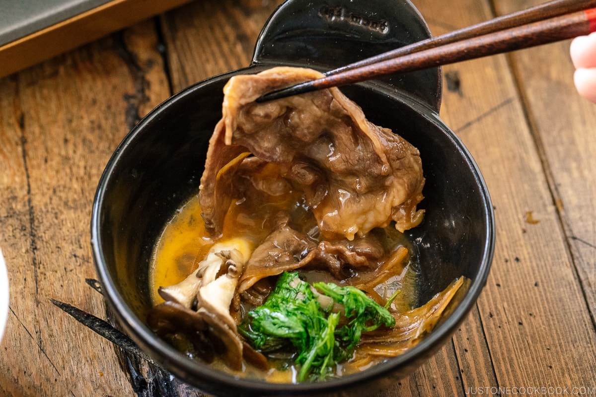 Sukiyaki dipped in raw egg.