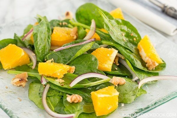 Spinach Salad with Asian Salad Dressing on a plate.