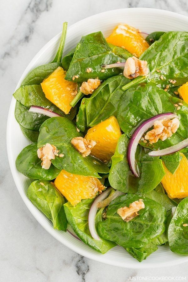 Spinach Salad with Asian Salad Dressing on a plate. 