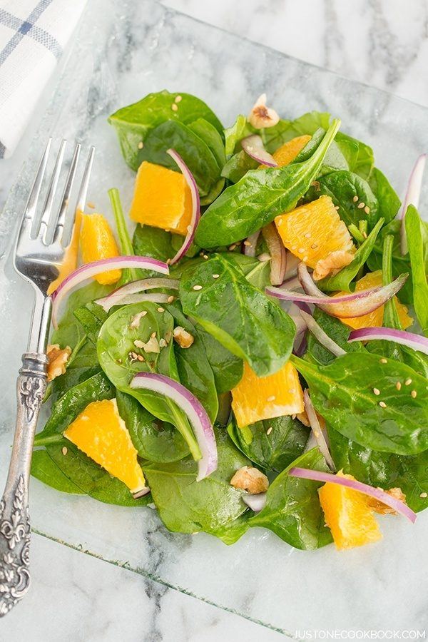 Spinach Salad with Asian Salad Dressing on a plate.