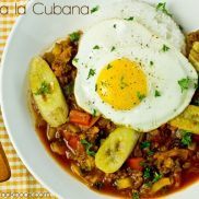 Arroz a la Cubana and white rice on a plate.