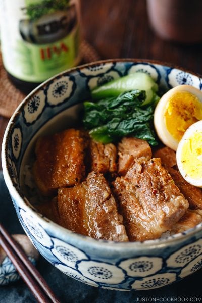 Pressure cooker kakuni (Instant Pot Japanese Pork Belly) served over rice along with eggs and greens in donburi bowl.