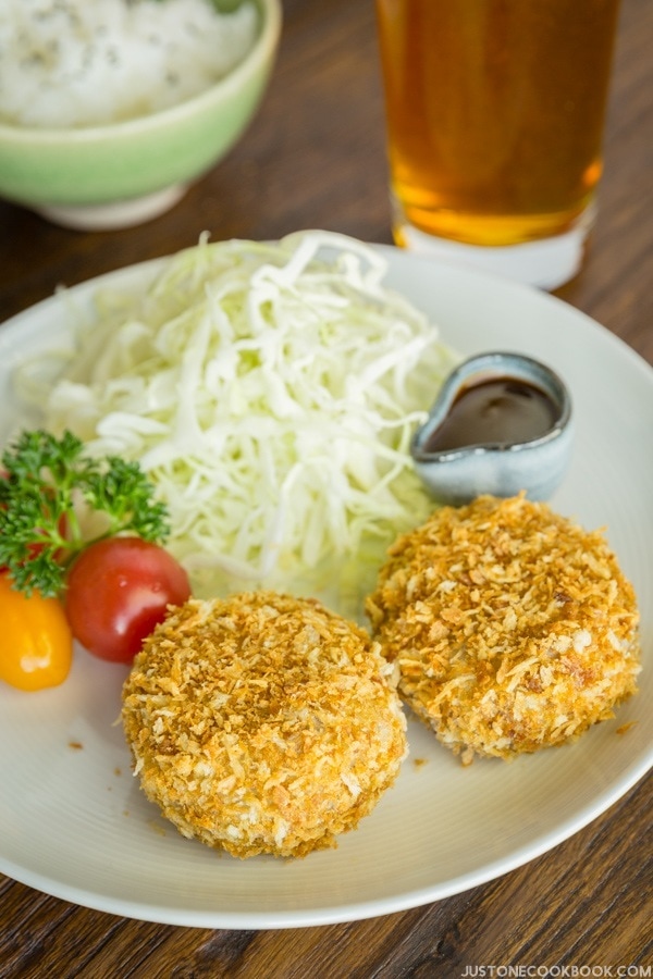 Baked Croquette and salad on a plate.