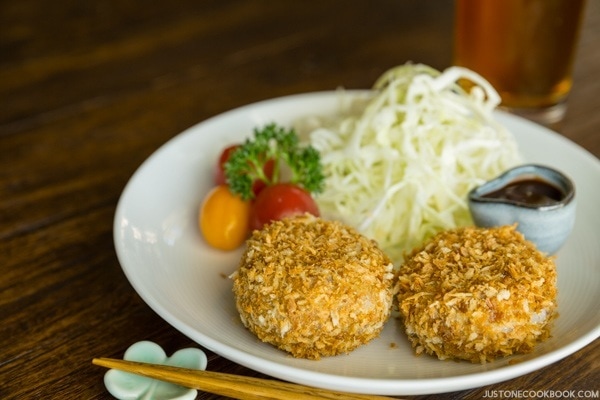 Baked Croquette and salad on a plate.