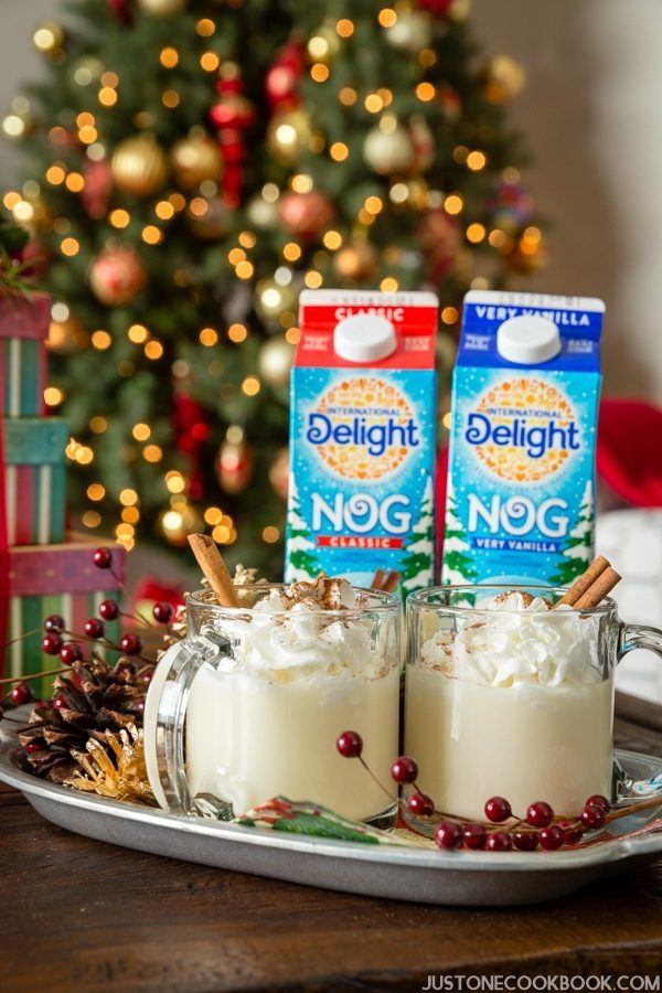 Eggnog in cartons and glasses.