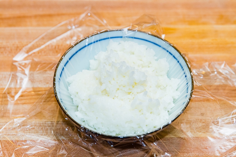Store cooked rice in plastic wrap and freeze it.