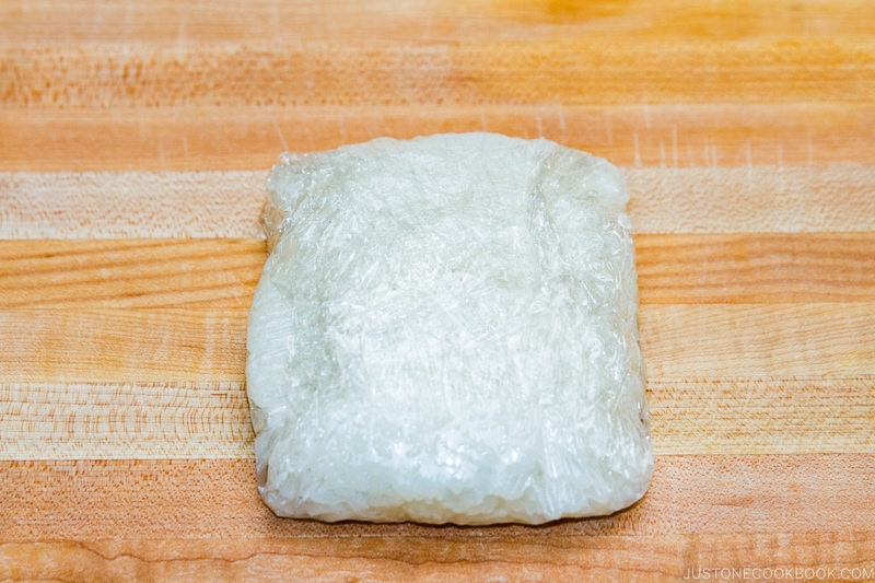 Store cooked rice in plastic wrap and freeze it.