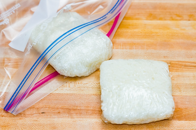 Store cooked rice in plastic wrap and freeze it.