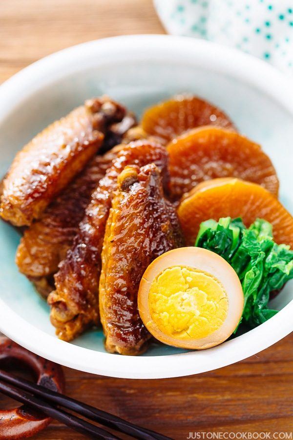 Slow Cooker Chicken Wings, egg, spinach and daikon in a bowl.