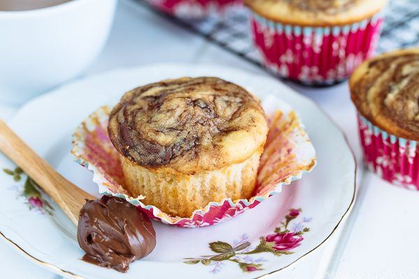 Caramelized Banana Muffins on a plate with Nutella.