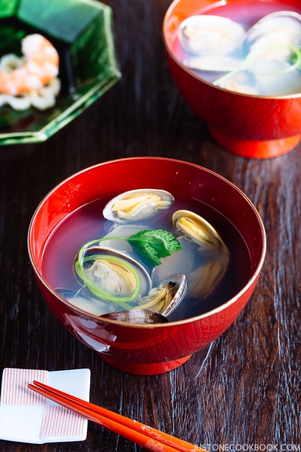 Japanese Clam Soup with Clear Broth in a red bowl.