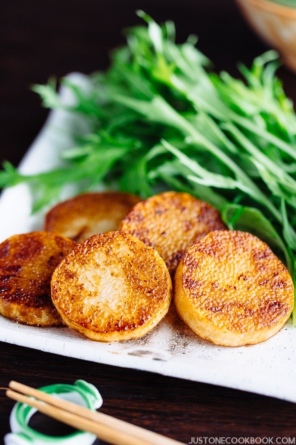 Sauteed Yam and salad on the white plate.