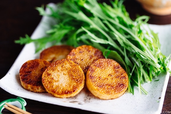 Sauteed Yam and salad on the white plate.