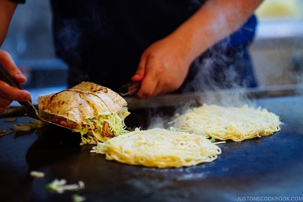 okonomiyaki being cooked at Mitchan in Hiroshima | Hiroshima Japan Guide JustOneCookbook.com