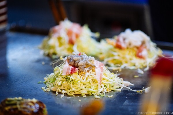 okonomiyaki being cooked at Mitchan in Hiroshima | Hiroshima Japan Guide JustOneCookbook.com