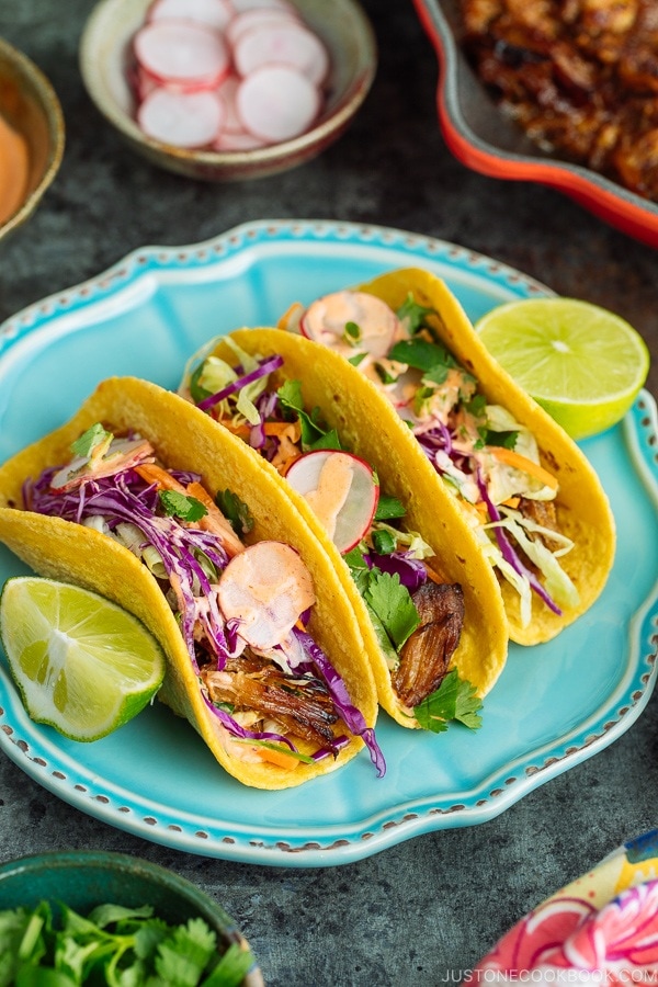 Asian Pulled Pork Tacos with drizzle of Sriracha mayo.